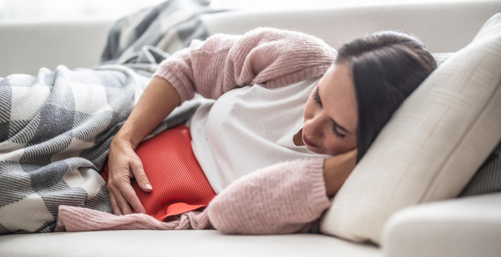 PMS, menstruační bolesti. Menstruace.